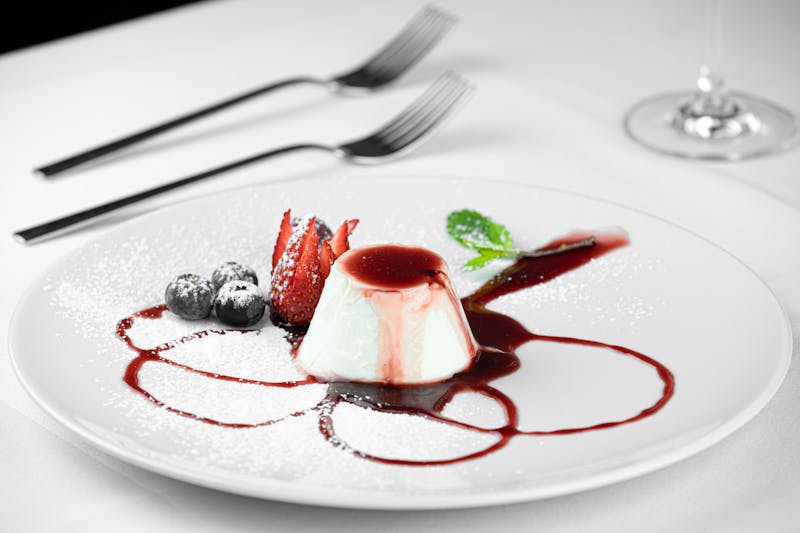 Panna Cotta al Limone with lemon and berry coulis