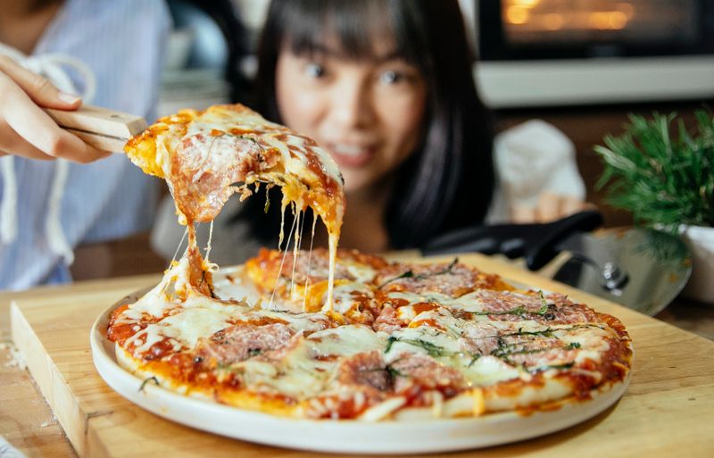Classic Margherita pizzana with fresh basil
